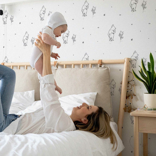 Mum with new born baby with cute wallpaper